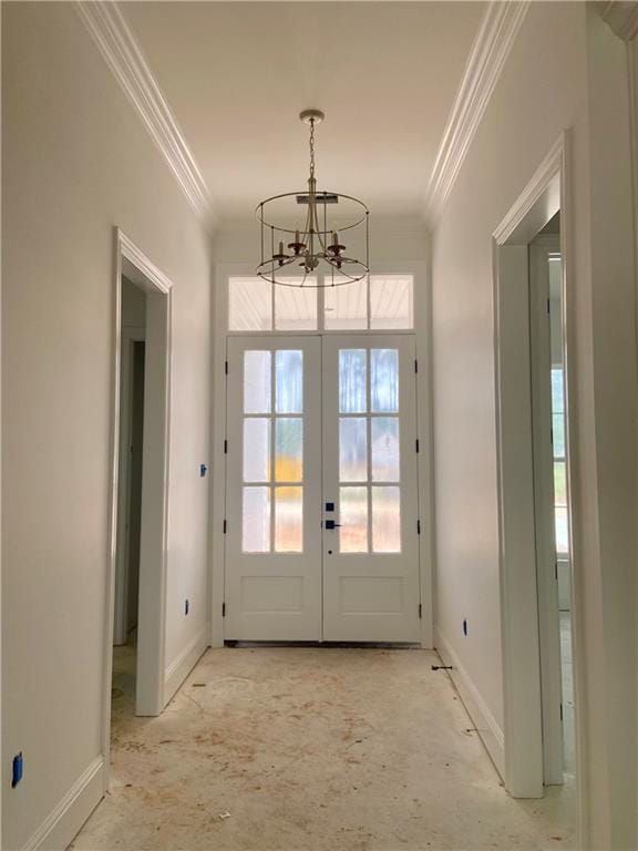 4141 Endor Loop, Mandeville, LA 70448 - doorway featuring baseboards, a notable chandelier, and ornamental molding