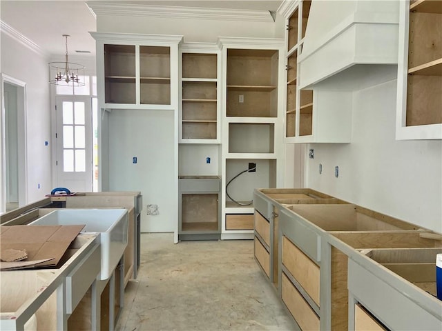 4141 Endor Loop, Mandeville, LA 70448 - kitchen featuring a chandelier, concrete floors, custom exhaust hood, decorative light fixtures, and ornamental molding