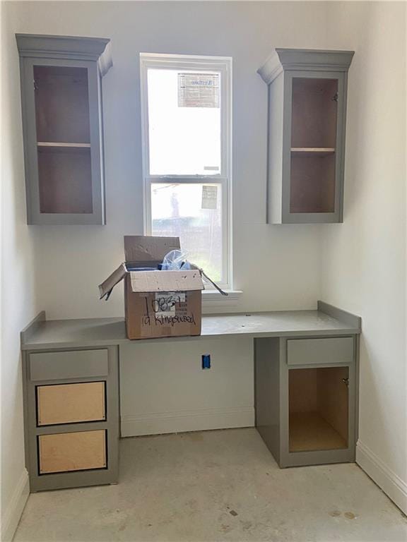 4141 Endor Loop, Mandeville, LA 70448 - office space with baseboards, unfinished concrete flooring, and a healthy amount of sunlight
