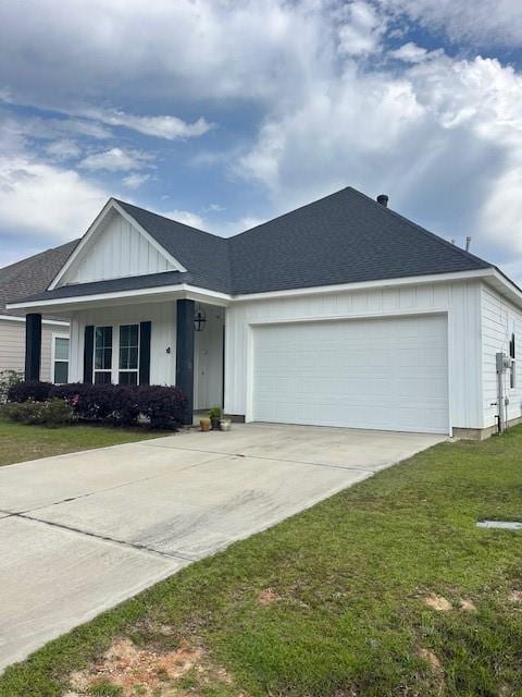 single story home with a shingled roof, an attached garage, a front lawn, board and batten siding, and driveway