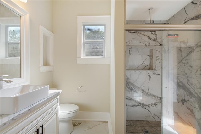 full bathroom featuring vanity, toilet, a marble finish shower, marble finish floor, and a healthy amount of sunlight