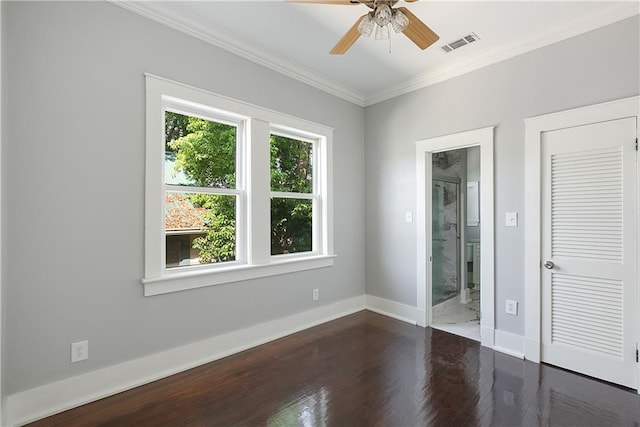 unfurnished room featuring visible vents, a ceiling fan, crown molding, and wood finished floors