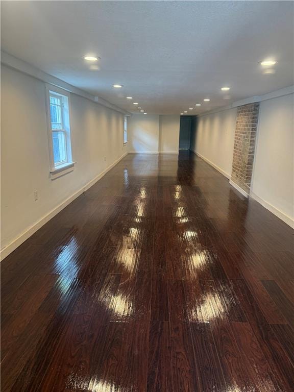 spare room with recessed lighting, baseboards, and hardwood / wood-style flooring
