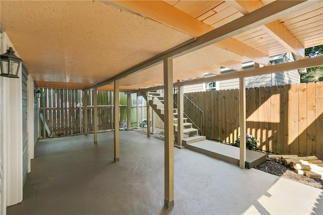 view of patio featuring fence