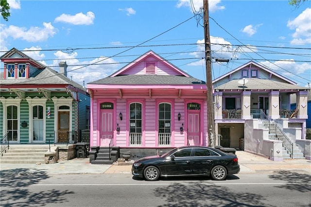 2009-11 N Claiborne Ave, New Orleans, LA 70116 - view of front facade featuring a shingled roof