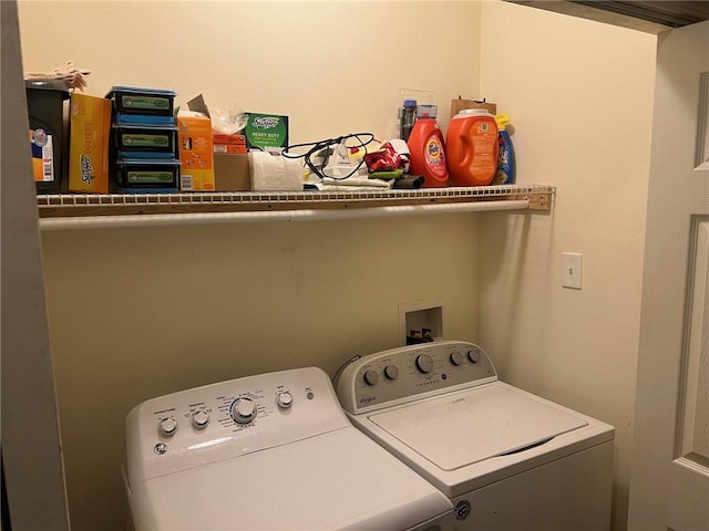 washroom featuring laundry area and washer and dryer