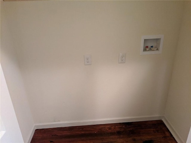 washroom featuring dark wood-type flooring, washer hookup, and baseboards