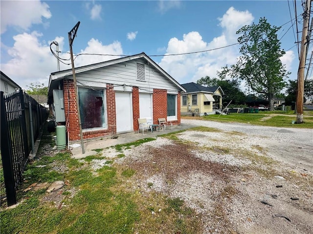 726 Labarre Rd, Jefferson, LA 70121 - rear view of property with brick siding, fence, and a patio area