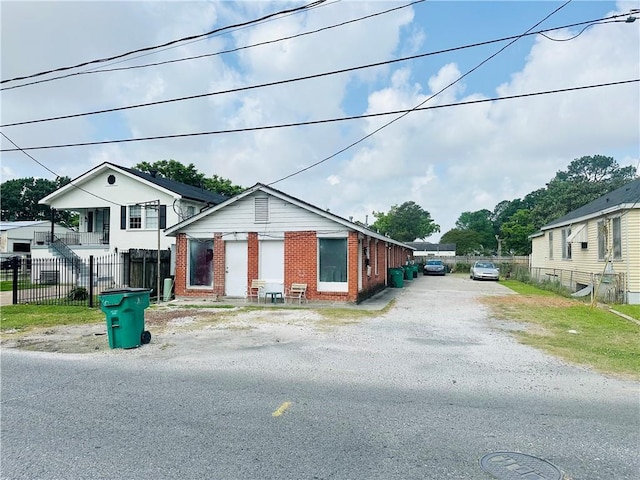 726 Labarre Rd, Jefferson, LA 70121 - view of front of property with brick siding, fence, and driveway