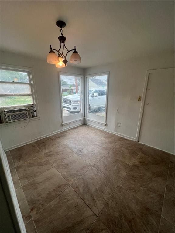 726 Labarre Rd, Jefferson, LA 70121 - unfurnished dining area with a chandelier, plenty of natural light, and cooling unit