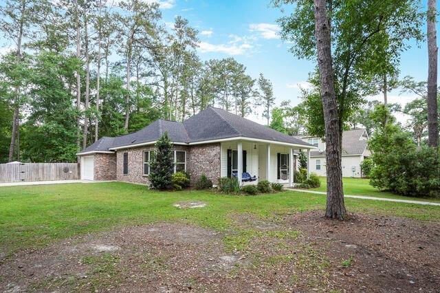 166 Egret St, Covington, LA 70433 - single story home with a garage and covered porch