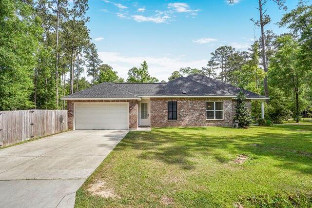 166 Egret St, Covington, LA 70433 - ranch-style home with an attached garage, driveway, and brick siding