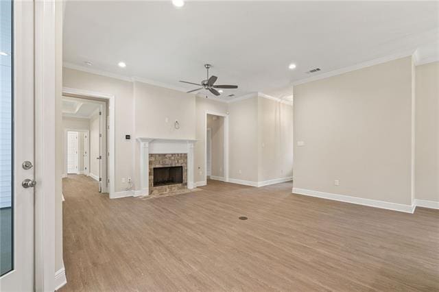 166 Egret St, Covington, LA 70433 - unfurnished living room featuring ceiling fan, ornamental molding, recessed lighting, light wood-type flooring, and baseboards