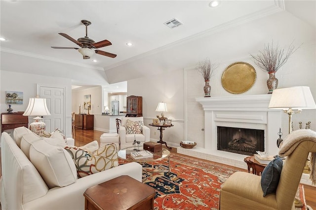 living area featuring a ceiling fan, visible vents, wood finished floors, and recessed lighting