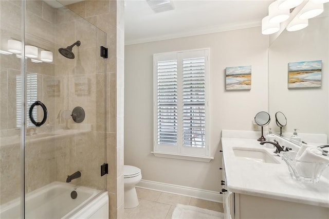 bathroom featuring toilet, baseboards, ornamental molding, and vanity
