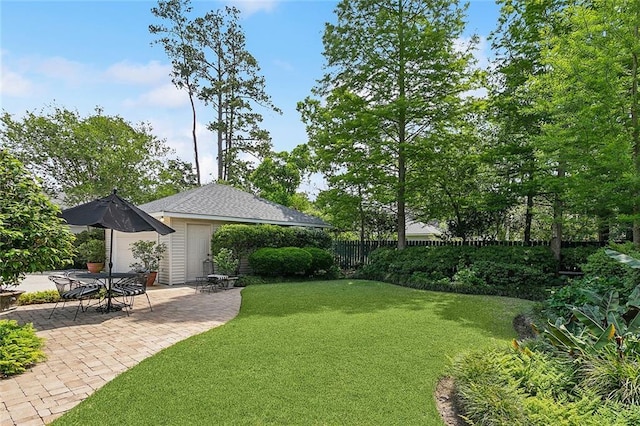 view of yard with fence and a patio