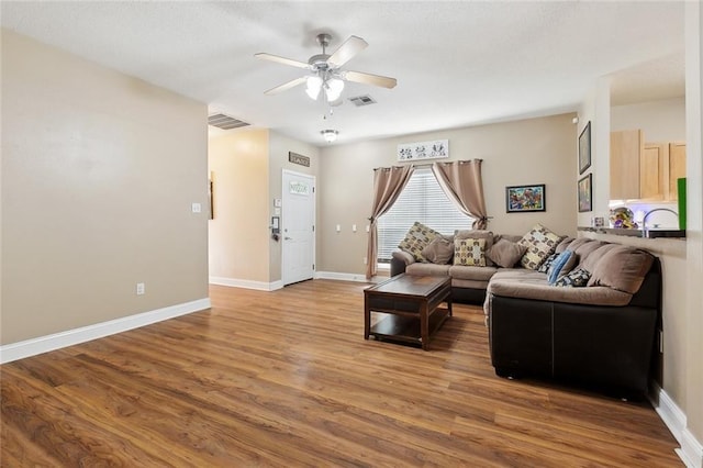 2733 Conor Ct, Marrero, LA 70072 - living area featuring ceiling fan, wood finished floors, and baseboards