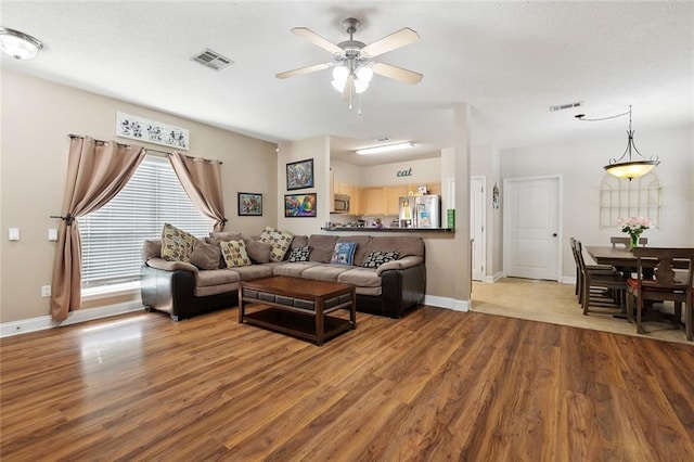 2733 Conor Ct, Marrero, LA 70072 - living room featuring wood finished floors, ceiling fan, and baseboards