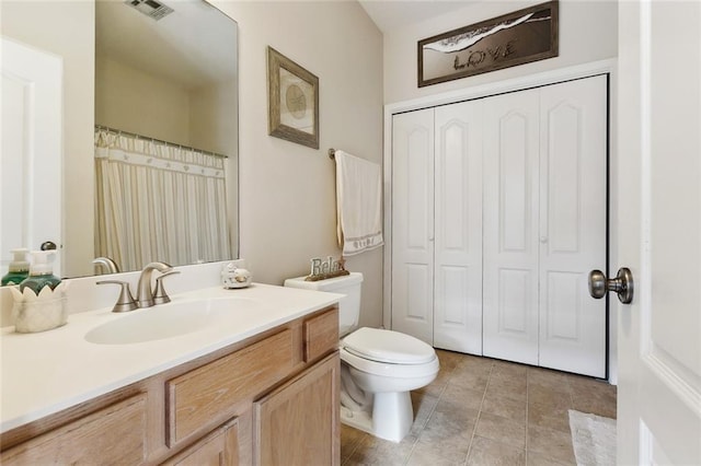 2733 Conor Ct, Marrero, LA 70072 - bathroom featuring vanity, toilet, tile patterned flooring, and a closet