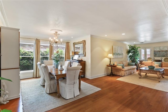3705 Clifford Dr, Metairie, LA 70002 - dining space with crown molding, wood finished floors, baseboards, recessed lighting, and a notable chandelier
