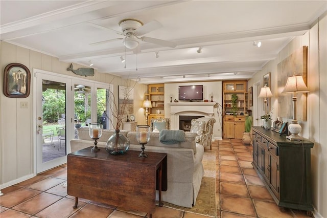 3705 Clifford Dr, Metairie, LA 70002 - living room with a ceiling fan, light tile patterned flooring, french doors, and a fireplace