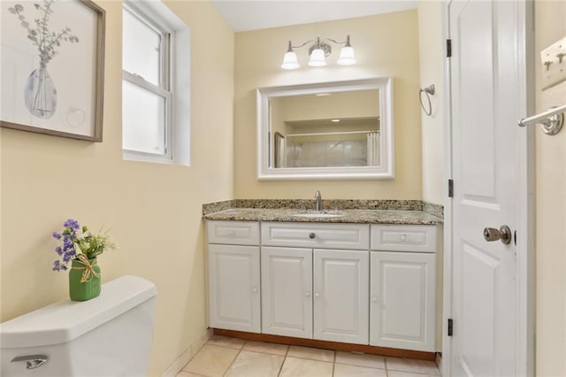 3705 Clifford Dr, Metairie, LA 70002 - full bathroom with toilet, baseboards, tile patterned flooring, and vanity