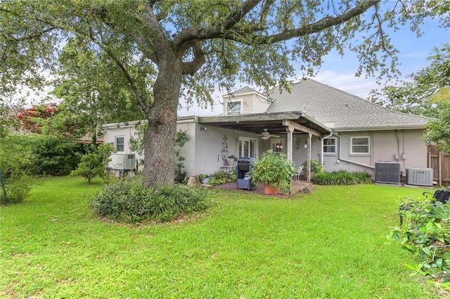 3705 Clifford Dr, Metairie, LA 70002 - rear view of property featuring a lawn, ceiling fan, and central AC
