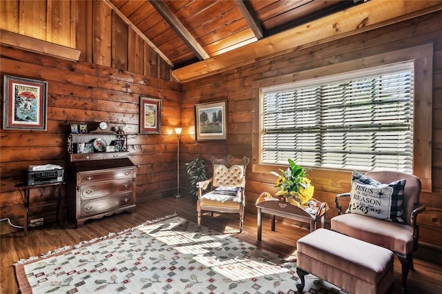 living area featuring wood ceiling, lofted ceiling with beams, dark wood-style flooring, and wood walls