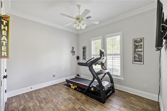 workout area featuring a ceiling fan, baseboards, wood finished floors, visible vents, and ornamental molding