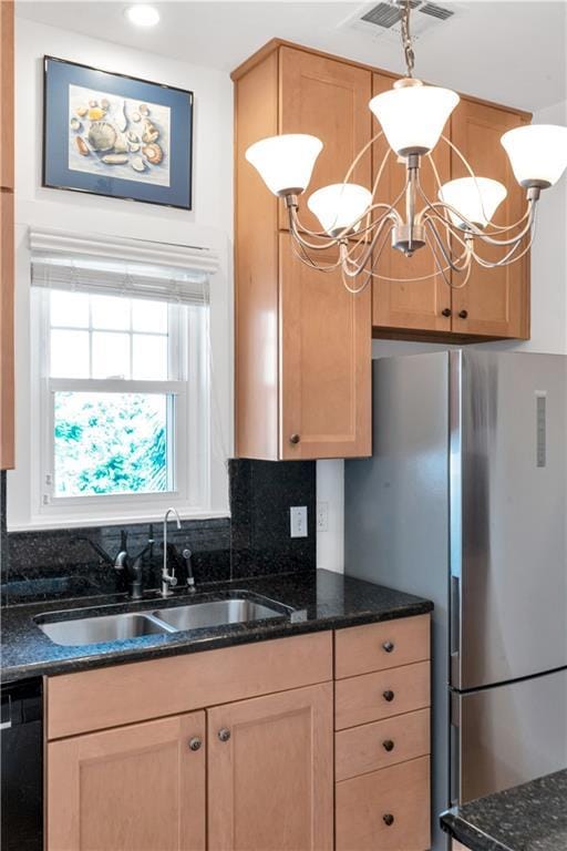 4716 Annunciation St Unit 2E, New Orleans, LA 70115 - kitchen featuring visible vents, a sink, decorative backsplash, and light brown cabinets