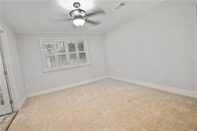 unfurnished room featuring a ceiling fan, visible vents, light carpet, and ornamental molding