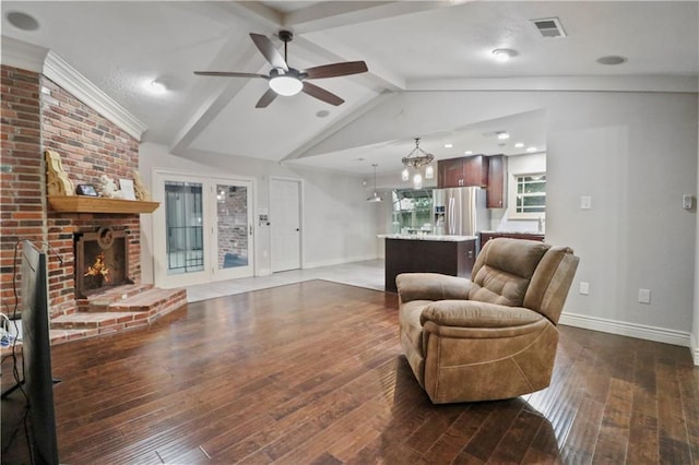 living room featuring a ceiling fan, visible vents, dark wood finished floors, baseboards, and vaulted ceiling with beams