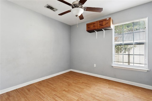 21221 Fern St, Covington, LA 70435 - unfurnished room featuring visible vents, a ceiling fan, light wood-style floors, and baseboards