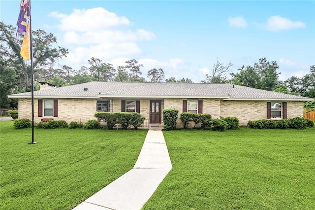 3808 Thomas Dr, Slidell, LA 70458 - ranch-style home with brick siding, roof with shingles, and a front lawn