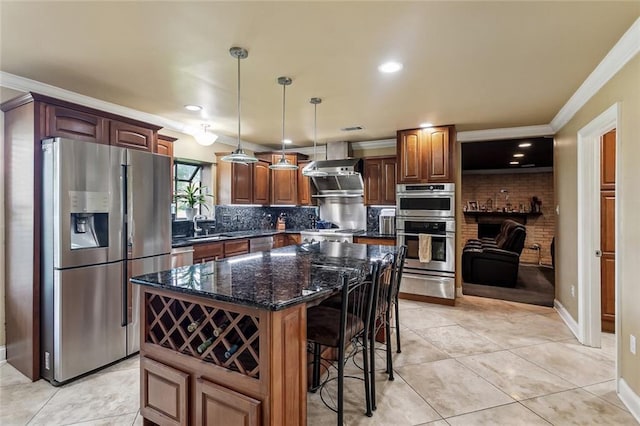 3808 Thomas Dr, Slidell, LA 70458 - kitchen with ornamental molding, a warming drawer, a breakfast bar area, backsplash, and stainless steel appliances