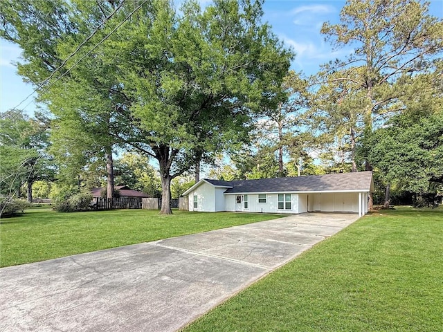 single story home featuring fence, a carport, driveway, and a front yard