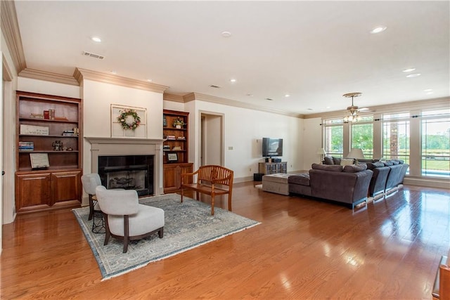 14208 W Hoffman Rd, Hammond, LA 70403 - living room with a glass covered fireplace, recessed lighting, and wood finished floors