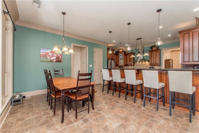 14208 W Hoffman Rd, Hammond, LA 70403 - dining room with baseboards, ornamental molding, recessed lighting, and stone tile floors