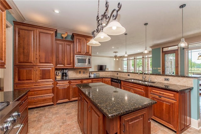 14208 W Hoffman Rd, Hammond, LA 70403 - kitchen featuring brown cabinetry, a sink, plenty of natural light, and stainless steel appliances