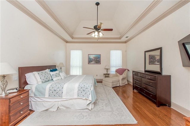 14208 W Hoffman Rd, Hammond, LA 70403 - bedroom with crown molding, baseboards, a raised ceiling, and wood finished floors