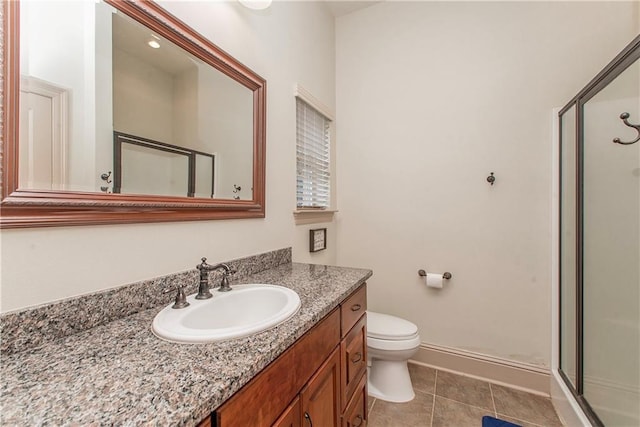 14208 W Hoffman Rd, Hammond, LA 70403 - full bathroom with vanity, toilet, baseboards, tile patterned floors, and a stall shower