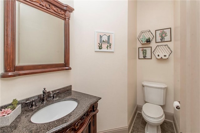 14208 W Hoffman Rd, Hammond, LA 70403 - bathroom featuring vanity, baseboards, toilet, and tile patterned flooring