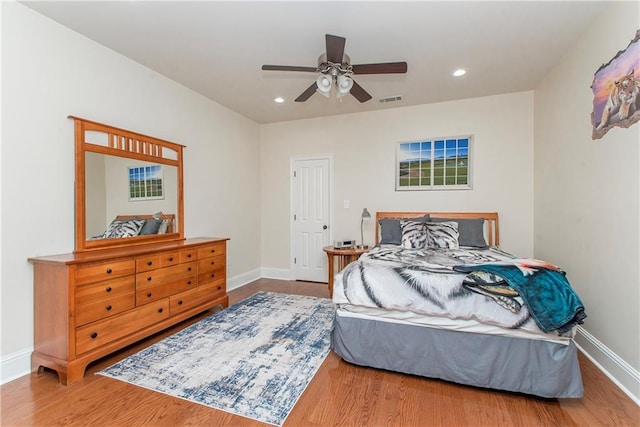 14208 W Hoffman Rd, Hammond, LA 70403 - bedroom featuring baseboards, recessed lighting, wood finished floors, and visible vents