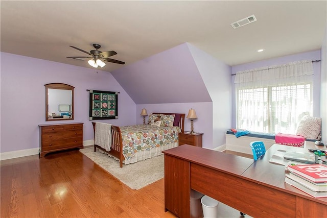 14208 W Hoffman Rd, Hammond, LA 70403 - bedroom with baseboards, vaulted ceiling, light wood-style flooring, and visible vents