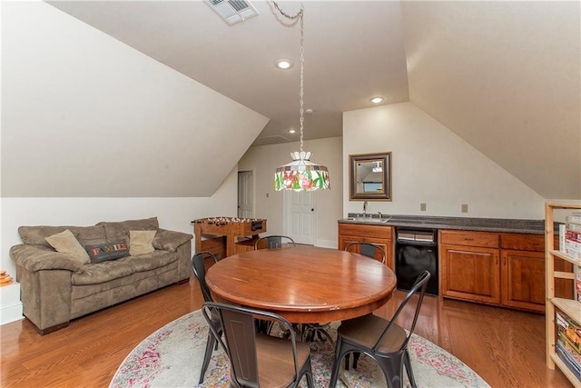 14208 W Hoffman Rd, Hammond, LA 70403 - dining area with recessed lighting, visible vents, lofted ceiling, and light wood-type flooring
