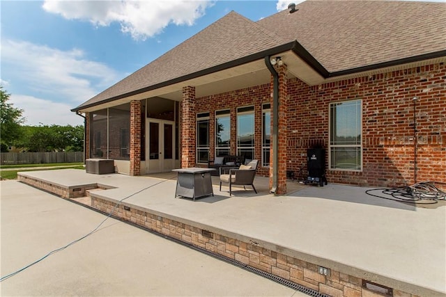 14208 W Hoffman Rd, Hammond, LA 70403 - exterior space with a sunroom, a fire pit, fence, and french doors