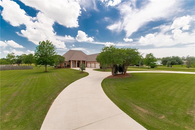 14208 W Hoffman Rd, Hammond, LA 70403 - view of front of property with fence, curved driveway, and a front lawn