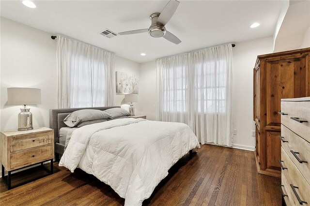 bedroom featuring dark wood-style flooring, a ceiling fan, baseboards, recessed lighting, and visible vents