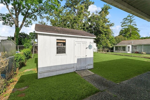 view of shed featuring a fenced backyard