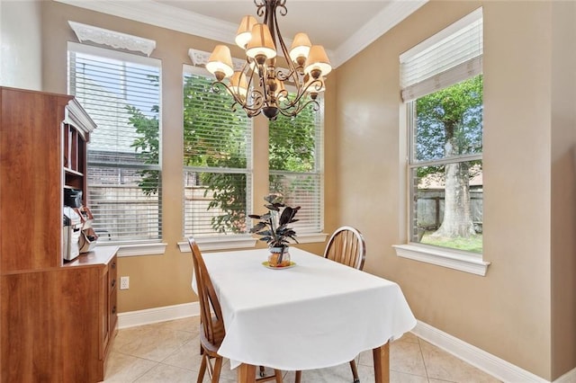 1045 Whitetail Dr, Mandeville, LA 70448 - dining space featuring light tile patterned floors, a chandelier, ornamental molding, and baseboards